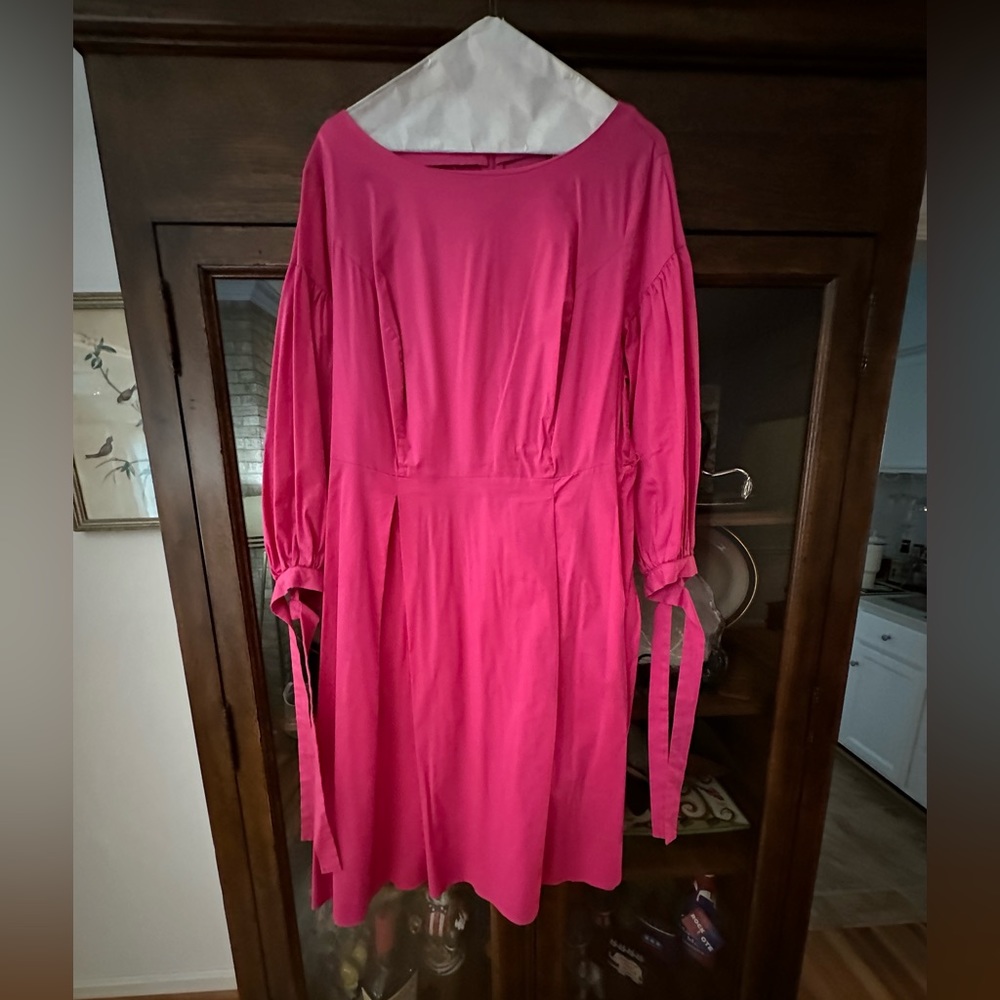 Pretty in PINK! Cute dress with ties on the sleeves. Perfect spring dress.